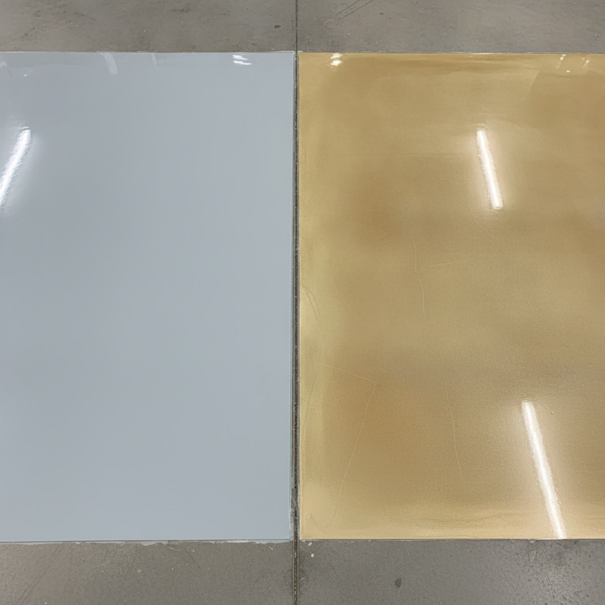Side-by-side comparison of a fresh pale grey epoxy floor patch next to one that has yellowed and ambered from UV exposure
